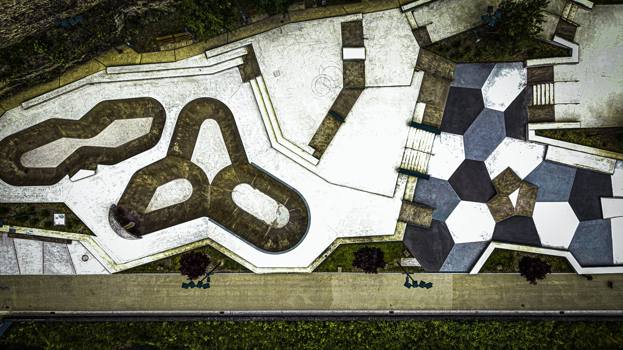 The Pétrusse skate park from directly above — geometry beneath the Passerelle viaduct