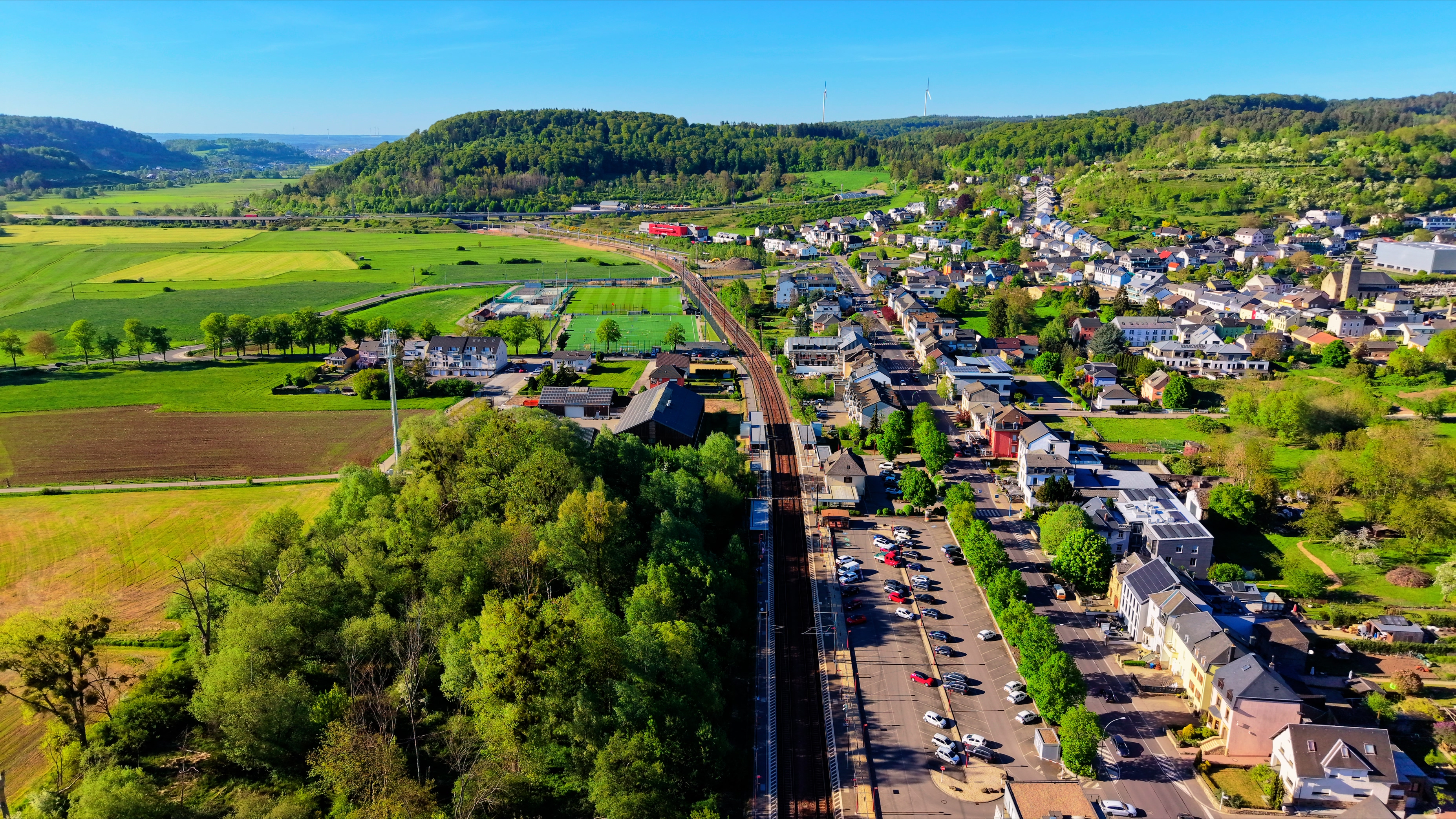 Walferdange from altitude — town, railway, valley